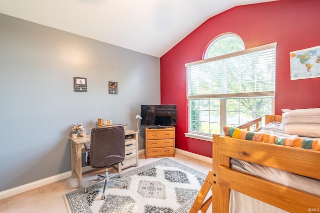 bedroom featuring vaulted ceiling, multiple windows, light carpet, an office area, and baseboards