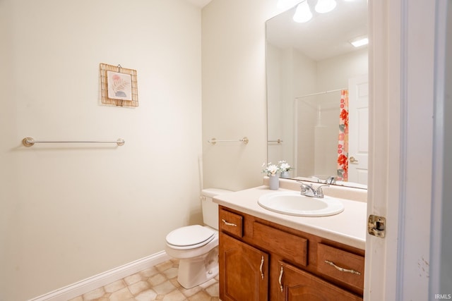 bathroom featuring toilet, vanity, baseboards, and a shower with shower curtain