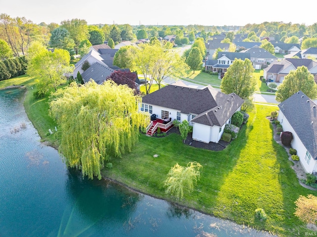 aerial view of residential area with a large body of water