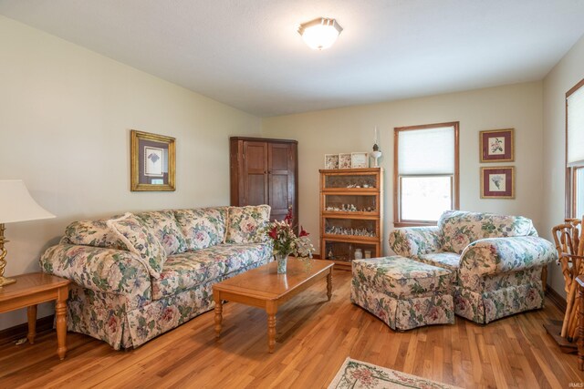 living area with plenty of natural light and light wood-type flooring