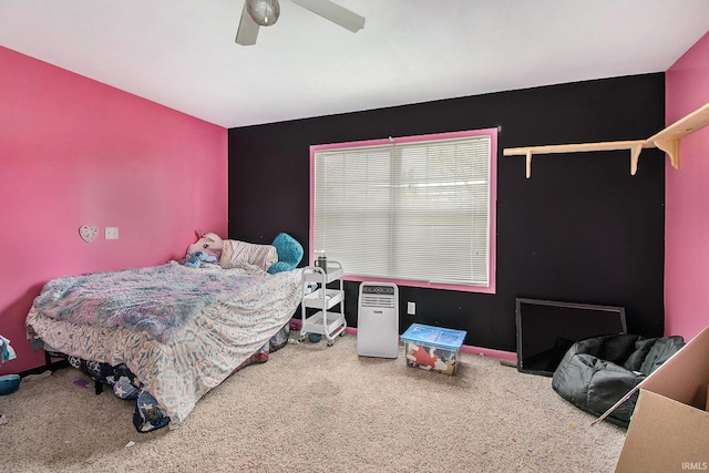 carpeted bedroom featuring ceiling fan
