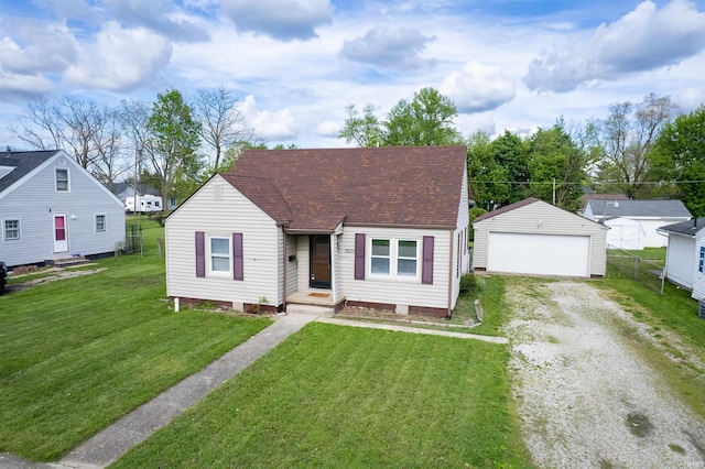 view of front of property with an outdoor structure, roof with shingles, a detached garage, a front yard, and entry steps
