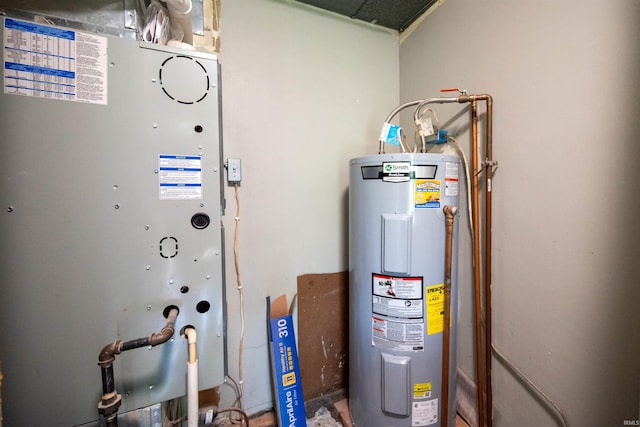 utility room featuring water heater and heating unit