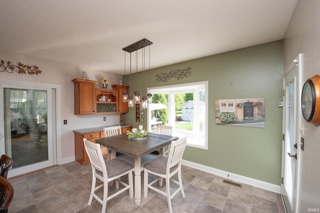 dining area featuring baseboards