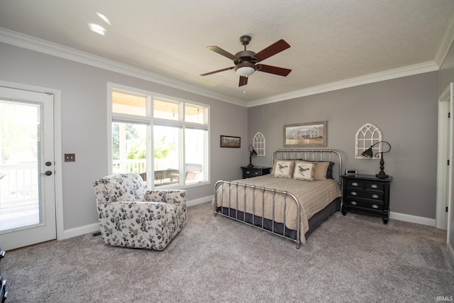 carpeted bedroom featuring ornamental molding, baseboards, and ceiling fan