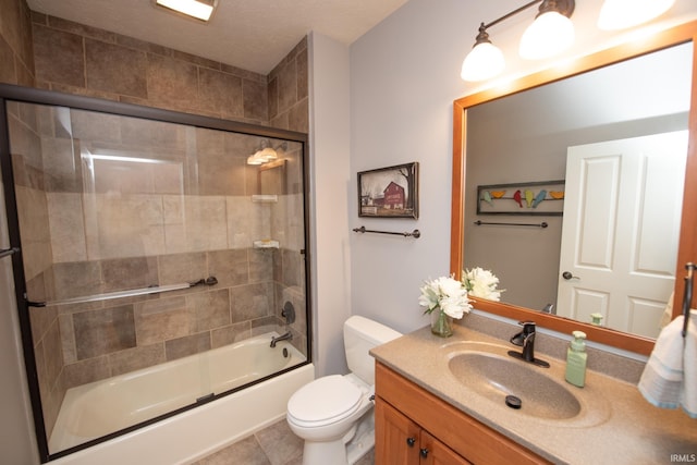 full bath featuring vanity, toilet, enclosed tub / shower combo, and tile patterned flooring