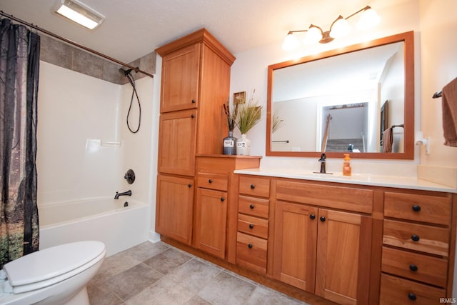 bathroom with shower / bath combo, toilet, vanity, and tile patterned flooring