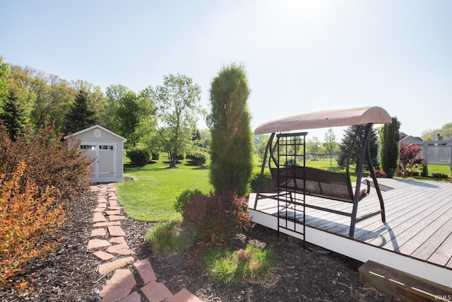 view of green lawn with a deck, an outbuilding, and a storage unit