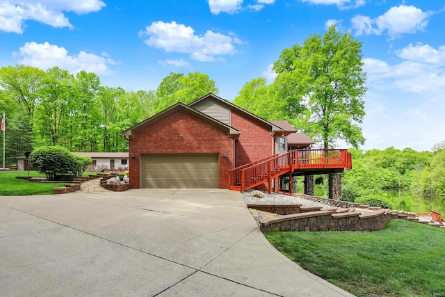 5571 Poff Rd, Martinsville, IN 46151 - view of front of house featuring brick siding, concrete driveway, a garage, a front yard, and a deck