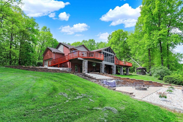 5571 Poff Rd, Martinsville, IN 46151 - back of property with a fire pit, a deck, a yard, stone siding, and a gazebo