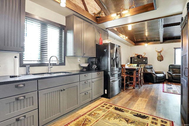 5571 Poff Rd, Martinsville, IN 46151 - kitchen featuring gray cabinetry, a sink, light wood-style floors, and wood ceiling