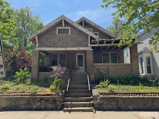 view of front of house with brick siding