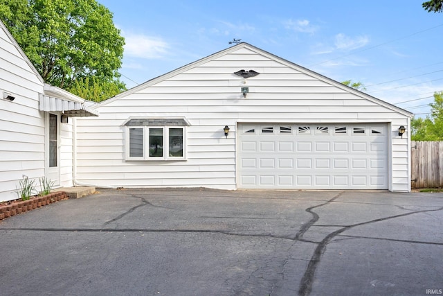 garage featuring fence