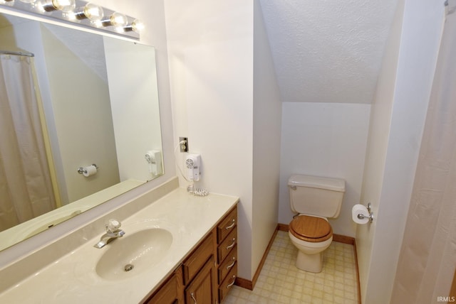 3010 Cypress Ct, Evansville, IN 47711 - bathroom with tile patterned floors, toilet, lofted ceiling, vanity, and baseboards