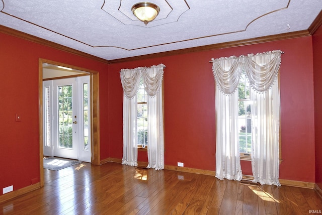 3010 Cypress Ct, Evansville, IN 47711 - empty room featuring a textured ceiling, hardwood / wood-style flooring, ornamental molding, and baseboards