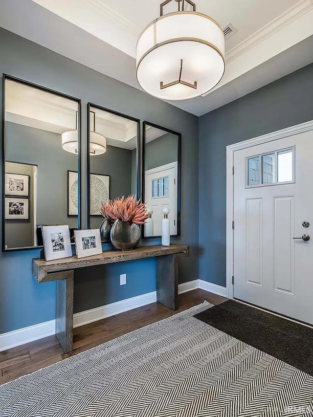 571 Tamarind Dr, West Lafayette, IN 47906 - entryway featuring wood finished floors, crown molding, and baseboards