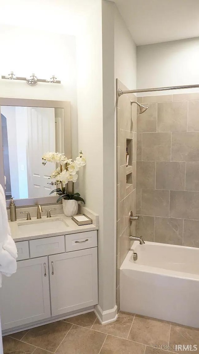 571 Tamarind Dr, West Lafayette, IN 47906 - full bathroom with tile patterned flooring, washtub / shower combination, and vanity