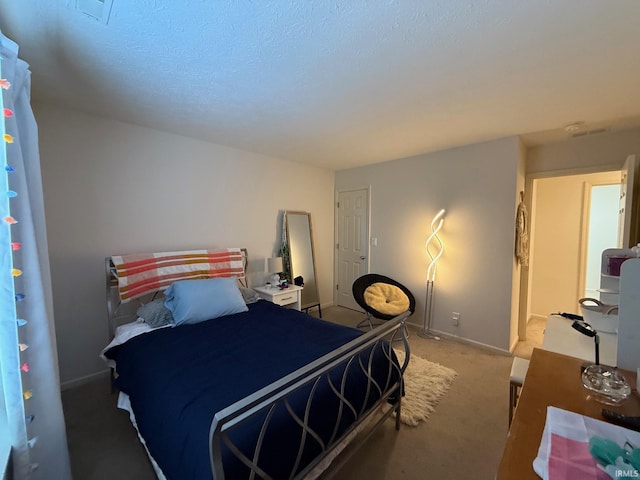 bedroom with carpet floors and baseboards