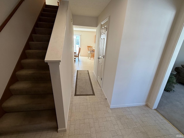 stairs featuring baseboards