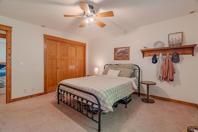 1918 Mckibben St, Wabash, IN 46992 - bedroom with light carpet, a closet, baseboards, and ceiling fan