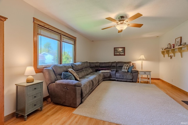 1918 Mckibben St, Wabash, IN 46992 - living area featuring light wood-style flooring, a ceiling fan, and baseboards