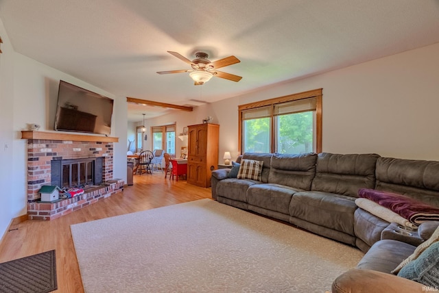 1918 Mckibben St, Wabash, IN 46992 - living area with a ceiling fan, light wood-type flooring, and a fireplace