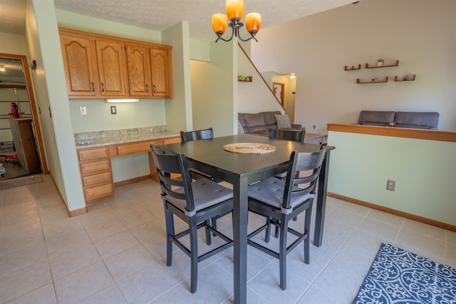 dining space with light tile patterned flooring, stairway, a chandelier, baseboards, and a textured ceiling