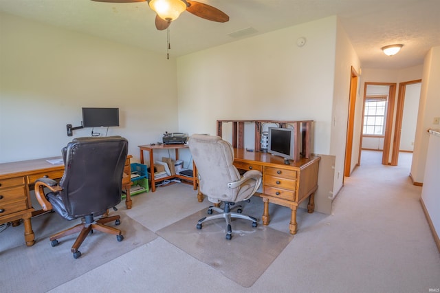 office with carpet flooring and ceiling fan