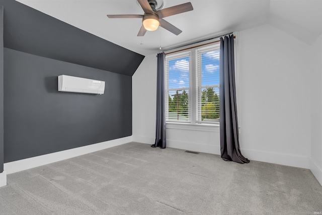 additional living space featuring a wall unit AC, vaulted ceiling, carpet floors, a ceiling fan, and baseboards