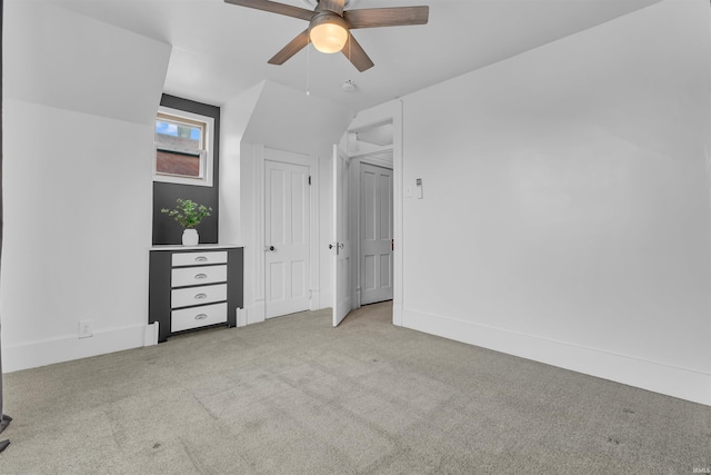 unfurnished bedroom featuring carpet and a ceiling fan