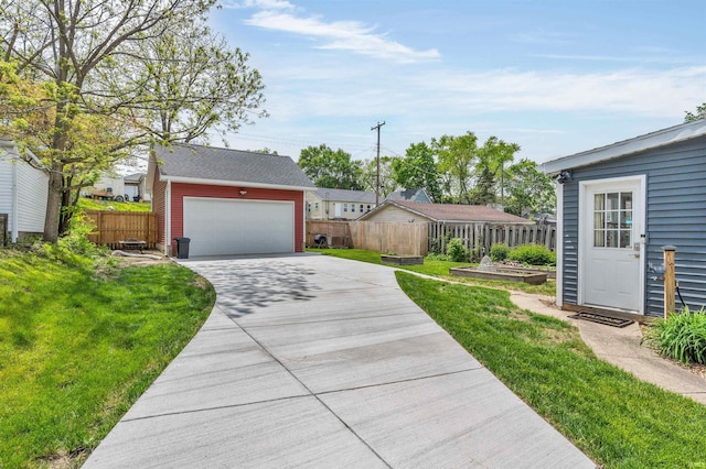 view of front of home featuring an outdoor structure and a detached garage