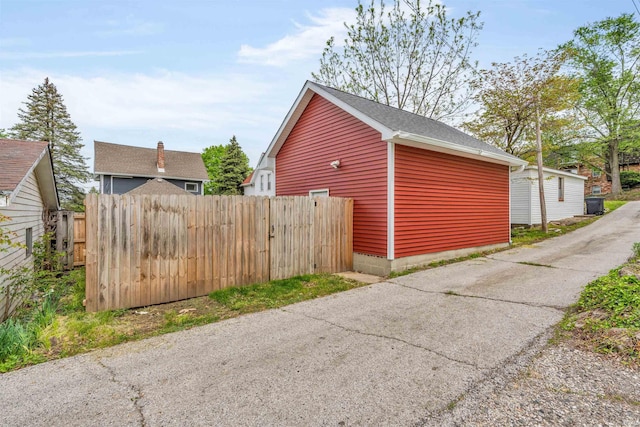 view of home's exterior featuring fence