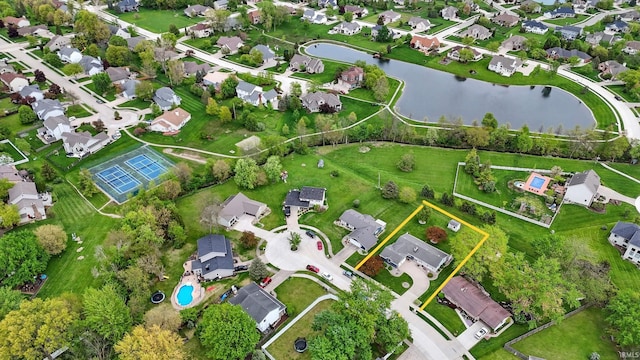 aerial view of property's location with a nearby body of water, property parcel outlined, and nearby suburban area
