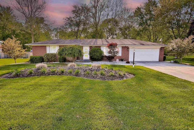 1430 Brookview Ave, Warsaw, IN 46580 - view of front of home with a garage, driveway, a front yard, and brick siding