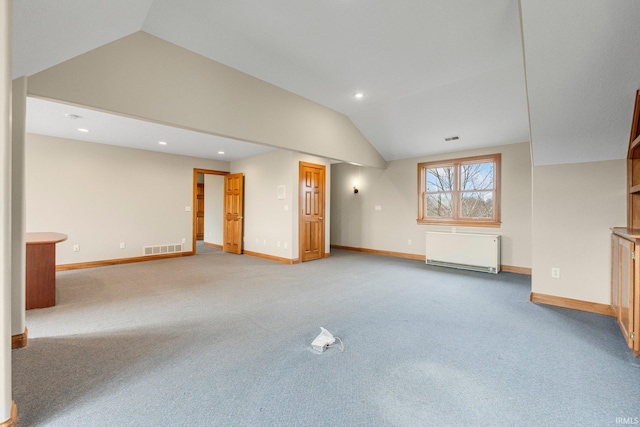 5006 Vandolah Rd, Leo, IN 46765 - unfurnished living room with vaulted ceiling, light carpet, baseboards, radiator heating unit, and recessed lighting