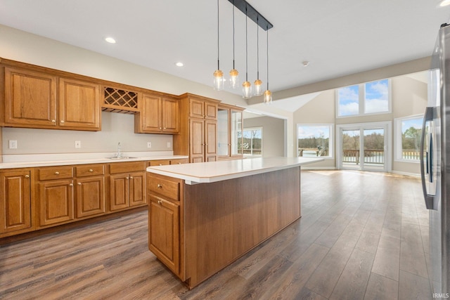 5006 Vandolah Rd, Leo, IN 46765 - kitchen featuring brown cabinetry, a kitchen island, freestanding refrigerator, dark wood-style floors, and recessed lighting