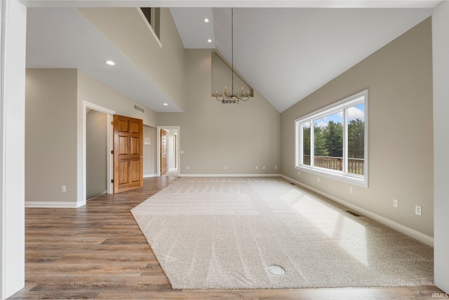 5006 Vandolah Rd, Leo, IN 46765 - empty room with baseboards, a chandelier, light wood finished floors, recessed lighting, and high vaulted ceiling