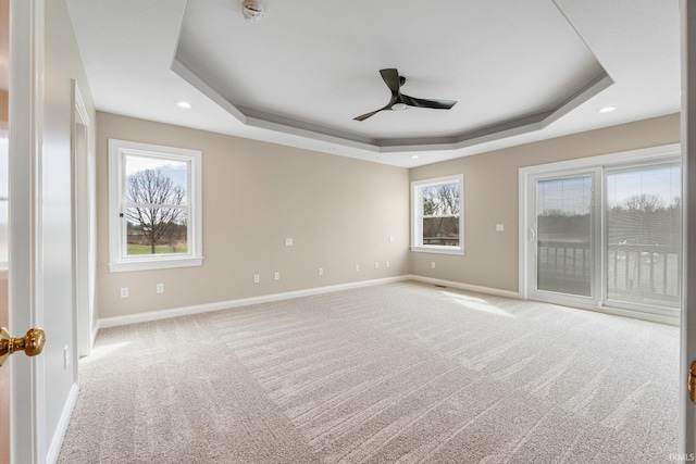 5006 Vandolah Rd, Leo, IN 46765 - empty room with a raised ceiling, a ceiling fan, baseboards, carpet floors, and recessed lighting