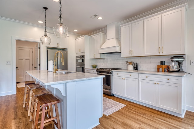 6055 Logel Rd, Newburgh, IN 47630 - kitchen with premium range hood, stainless steel appliances, a sink, a kitchen bar, and backsplash