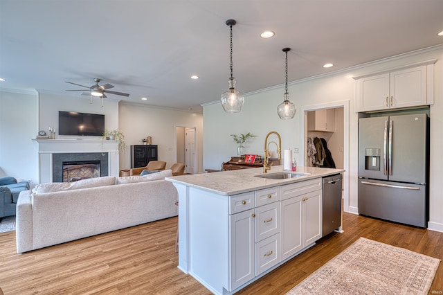6055 Logel Rd, Newburgh, IN 47630 - kitchen featuring stainless steel appliances, a sink, ornamental molding, white cabinetry, and ceiling fan