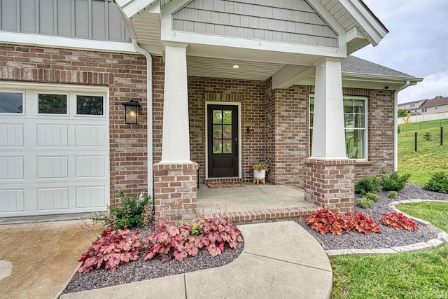 6055 Logel Rd, Newburgh, IN 47630 - view of exterior entry featuring brick siding, a porch, roof with shingles, and a garage