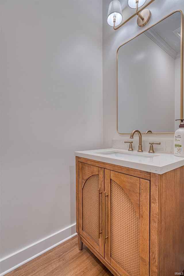 6055 Logel Rd, Newburgh, IN 47630 - bathroom with wood finished floors, baseboards, and vanity