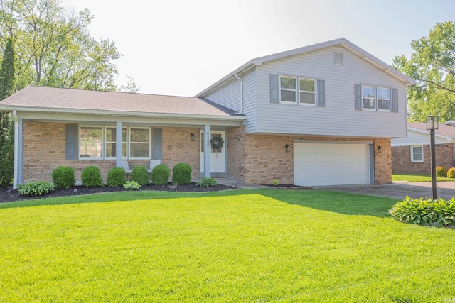 4100 Triple Crown Dr, Newburgh, IN 47630 - tri-level home with brick siding, a garage, a front yard, and driveway