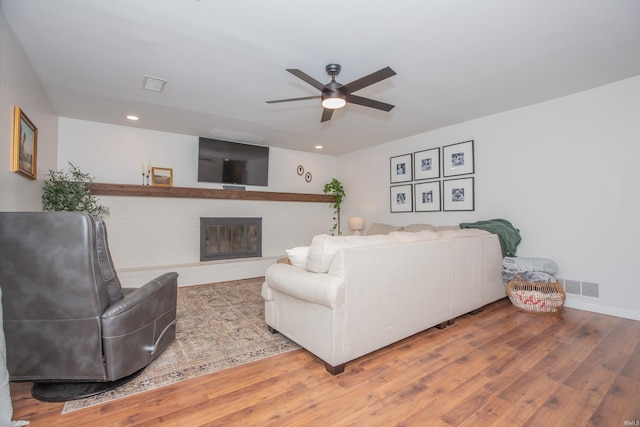 4100 Triple Crown Dr, Newburgh, IN 47630 - living room with a ceiling fan, wood finished floors, recessed lighting, a fireplace, and baseboards