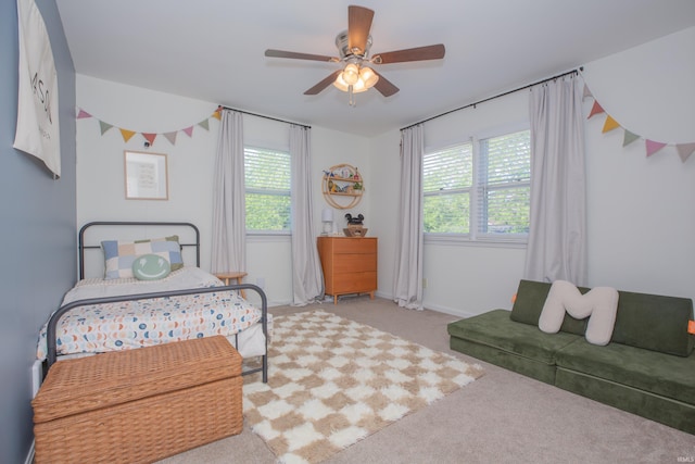4100 Triple Crown Dr, Newburgh, IN 47630 - carpeted bedroom featuring multiple windows, ceiling fan, and baseboards