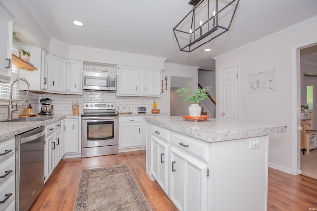 4100 Triple Crown Dr, Newburgh, IN 47630 - kitchen with appliances with stainless steel finishes, a sink, open shelves, decorative backsplash, and light countertops