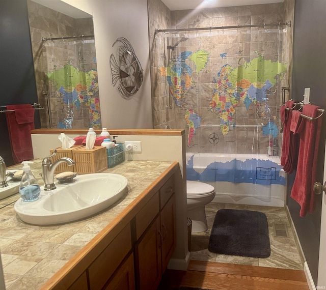 bathroom with vanity, toilet, and shower / bath combination with curtain