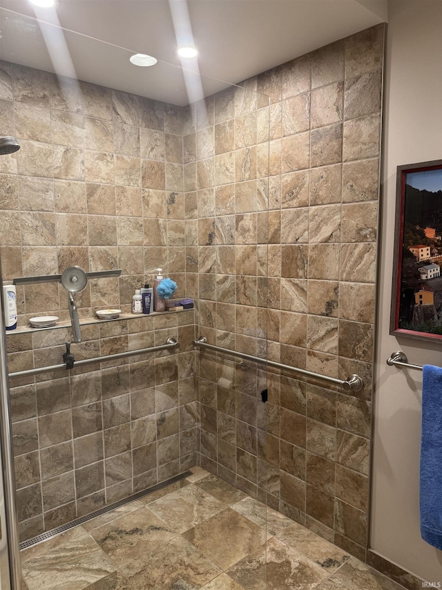 full bathroom with tiled shower