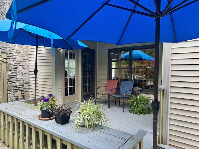 wooden deck with outdoor dining space