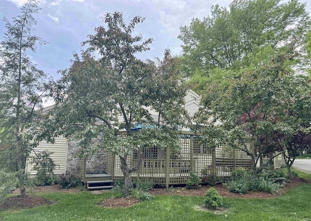 back of property featuring a lawn